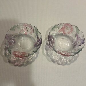 Decorative set of glass bowls with flowers of pink and purple and green leaves